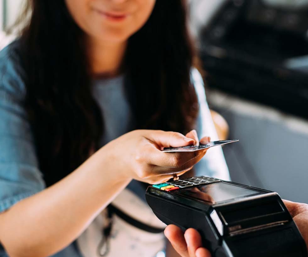 Woman using card to pay