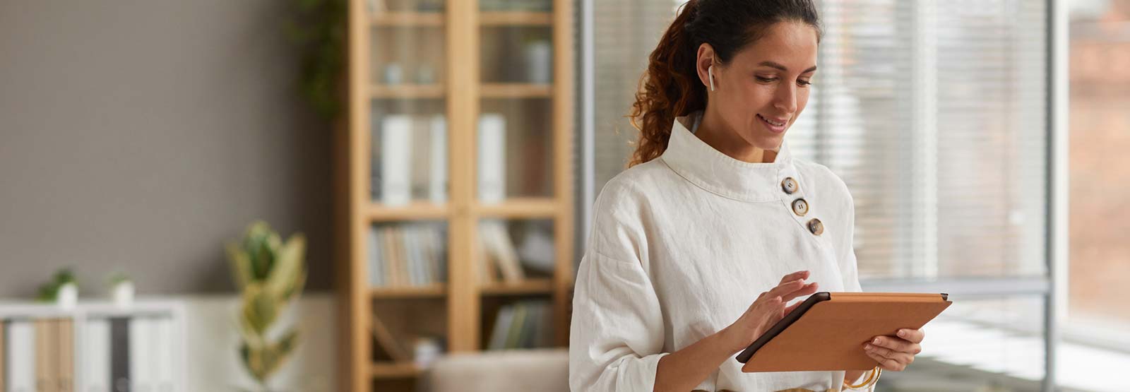 Woman using tablet in office